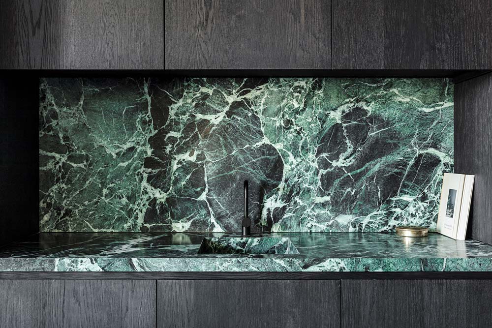 green stone in office kitchen